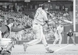  ?? Elaine Thompson / Associated Press ?? Third baseman Yulieski Gurriel singles in a pair of runs in the sixth inning as the Astros beat the Mariners for the second night in a row.