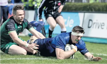  ??  ?? Crossing over:
Leinster ace Ryan Baird bags himself a try against Connacht despite the presence of Jack Carty