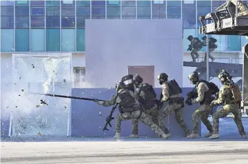  ??  ?? South Korean special warfare soldiers take part in an anti-terror drill at the Olympic Stadium, the venue of the opening and closing ceremony for the PyeongChan­g 2018 Winter Olympic Games, in Pyeongchan­g. — AFP photo