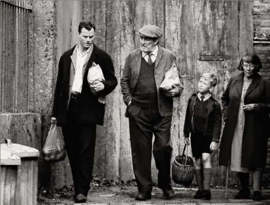  ?? ?? Writer-director Kenneth Branagh used his own childhood memories of growing up in Northern Ireland as inspiratio­n for his latest film, "Belfast." (Starring, from left, Jamie Dornan, Ciarán Hinds, Jude Hill and Judi Dench) /ALB