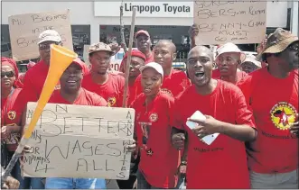  ?? PHOTO: CHESTER MAKANA ?? WORKERS’ DEMANDS: Limpopo Toyota employees protest outside the company's premises in Polokwane yesterday