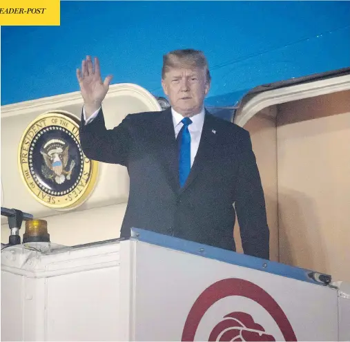  ?? SAUL LOEB/AFP/GETTY IMAGES ?? U.S. President Donald Trump waves after Air Force One arrives at Paya Lebar Air Base in Singapore on Sunday ahead of his planned meeting with North Korea’s leader Kim Jong Un. Trump used time on the plane to send tweets undoing work just accomplish­ed by G7 leaders in Quebec.