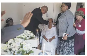  ?? Picture: Yeshiel Panchia ?? MOTHER’S PAIN. A pastor comforts Veronica Khambule at the funeral of both her children on Saturday.