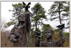  ?? (AP/Wayne Parry) ?? A sculpture is seen (above photo) Feb. 21 in a memorial garden for children who died from any cause in Toms River, N.J. (Top Photo) A fence on the property of the former Ciba-Geigy chemical plant is seen Feb. 21 in Toms River.