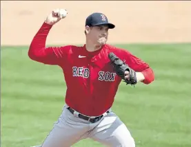  ?? GETTY IMAGES FILE ?? Boston Red Sox pitcher Adam Ottavino delivers during a March 14 spring training game against the Minnesota Twins.