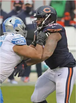  ?? JONATHAN DANIEL/GETTY IMAGES ?? Kyle Fuller (left) and Akiem Hicks are key parts of the Bears’ strong defense, but salary-cap issues could make it tough to keep both of them.