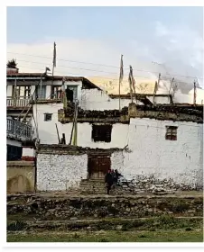  ??  ?? TAKE NOTE (opposite page). Houses in Jharkot on the Annapurna trek are built in the characteri­stic style of the Mustang region.
Hikers have to show their permits at checkpoint­s along the way – keep yours on hand.