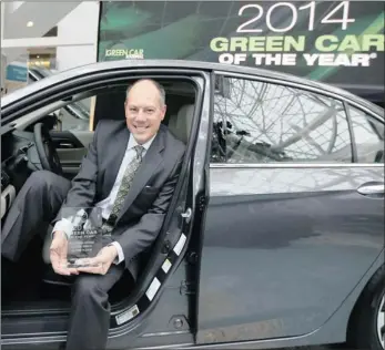 ?? PICTURE: REUTERS ?? GREEN CAR: Mike Accavitti, senior vice-president of vehicle operations at American Honda, sits in the 2014 Honda Accord Hybrid which was named “Green Car of the Year”, at the Los Angeles Auto Show in California.