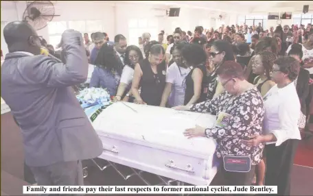  ??  ?? Family and friends pay their last respects to former national cyclist, Jude Bentley.