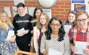  ??  ?? St John’s College pupils with their A-level results