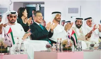  ?? WAM ?? ■ Shaikh Mohammad Bin Zayed and Moon Jae-in at a ceremony celebratin­g the completion of the Unit 1 reactor at the Barakah nuclear power plant. Shaikh Hamdan Bin Zayed, Shaikh Tahnoun and Shaikh Saif Bin Zayed Al Nahyan are present.