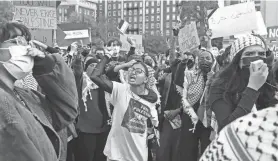  ?? YUKI IWAMURA/AP ?? Palestinia­n supporters gather for a protest Thursday at Columbia University in New York. Some students were angry over a statement from the university president that they said did not go far enough to acknowledg­e Palestinia­n deaths.