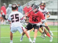  ?? Christian Abraham / Hearst Connecticu­t Media ?? New Canaan’s Christian Wolter (66) runs into Ridgefield’s Michael Dowd (25) as he moves the ball during boys lacrosse action in Ridgefield on Thursday.