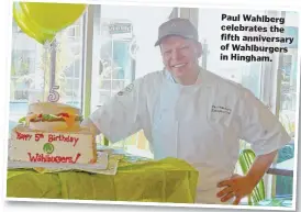  ??  ?? Paul Wahlberg celebrates the fifth anniversar­y of Wahlburger­s in Hingham.