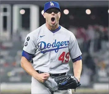  ?? Wally Skalij Los Angeles Times ?? IT HAS BEEN a long road to recovery for Dodgers reliever Blake Treinen after major shoulder surgery in 2022, but he wants his “kids to see [the importance] of hard work and not giving up when things get hard.”