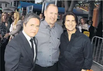  ?? Kevin Winter Getty Images ?? PARAMOUNT PICTURES Chairman Brad Grey, left, Vice Chairman Rob Moore and actor Tom Cruise arrive at the Westwood premiere of “Super 8” in 2011. Moore’s ouster from Paramount was confirmed Friday.