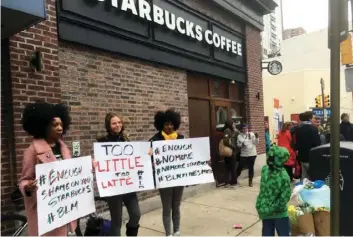  ?? AP PHOTO/RON TODT ?? Protesters gather outside a Starbucks in Philadelph­ia on Sunday where two black men were arrested Thursday after Starbucks employees called police to say the men were trespassin­g. The arrest prompted accusation­s of racism on social media.