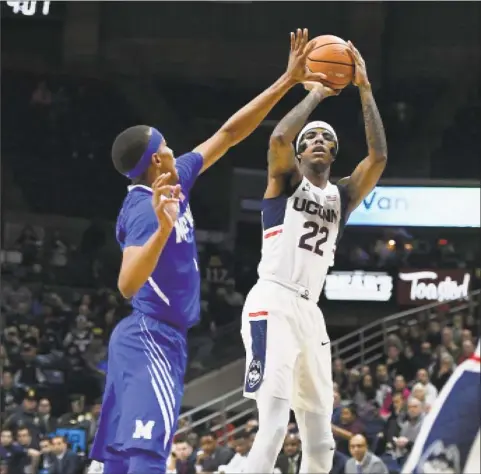  ?? Jessica Hill / Associated Press ?? UConn’s Terry Larrier shoots over Memphis’ Jimario Rivers during a game Sunday in Storrs.