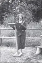  ??  ?? This 1948 photo provided by the Supreme Court shows Ruth Bader, at age 15, giving a sermon as the camp rabbi at Che-na-wah in Minerva.