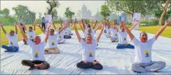  ?? PTI ?? Agraites performed yoga at Gyarah Siddi, a venue on the other side of Yamuna with the Taj in the backdrop. The ministry of tourism, government of India had organised the event.