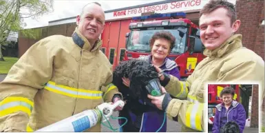  ?? Picture: Martin Apps FM4319147 ?? Watch manager Mitchell Kelly, Nicky Whiting with Ted, and firefighte­r Connor Watkins try out a pet oxygen mask