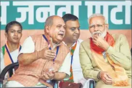  ?? PTI ?? Union minister and BJP Haryana incharge Narendra Singh Tomar with PM Narendra Modi at an election campaign rally in Charkhi Dadri on Tuesday.