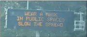  ?? STEPHEN FRYE— MEDIANEWS GROUP ?? A traffic and public service announceme­nt board alongside a freeway urges area residents towearmask­s.