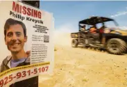  ?? Noah Berger / Special to The Chronicle ?? A search and rescue vehicle passes a poster for missing runner Philip Kreycik in Pleasanton.