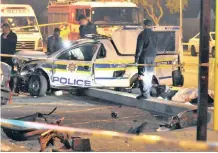  ??  ?? TWO police officers were killed in an accident on the corner of De la Rey and Market roads in Parow, Cape Town, last year. A silver BMW crashed into a police van, causing the occupants of the van to be ejected from the car. | Leon Knipe