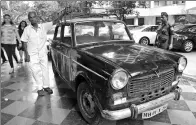  ?? INDRANIL MUKHERJEE / AGENCE FRANCE-PRESSE ?? Indian taxi driver Dawood Khan, 80, stands next to his Premiere Padmini taxi after dropping off a customer in Mumbai.