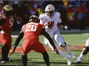  ?? Nick Wass / Associated Press ?? Ohio State quarterbac­k Dwayne Haskins Jr. runs with the ball against Maryland in 2018.