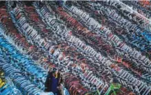  ??  ?? SHANGHAI: This picture taken on March 1, 2017 shows impounded bicycles from the bike-sharing schemes Mobike and Ofo. — AFP