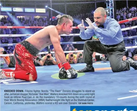  ?? TOP RANK PHOTO ?? KNOCKED DOWN. Filipino fighter Nonito “The Flash” Donaire struggles to stand up after Jamaican slugger Nicholas “Axe Man” Walters knocked him down on a solid right hook as referee Raul Caiz Jr. do the mandatory 10-counts during the sixth round of their...