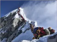  ?? HONS ?? In this photo made on May 22, 2019, a long queue of mountain climbers line a path on Mount Everest. About half a dozen climbers died on Everest last week most while descending from the congested summit during only a few windows of good weather each May.