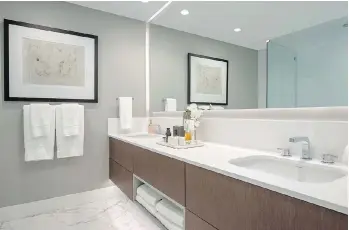  ?? COLLEEN BURKE PHOTOGRAPH­Y ?? The master ensuite. Bathrooms are fitted with Italian-style spacious cabinets, which includes a 24-inch medicine cabinet, Grohe faucets and eco-friendly dual-flush toilets.