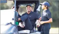  ?? Scott Audette / Associated Press ?? Tiger Woods, center, sits in a cart during the Pro-Am before the PNC Championsh­ip on Friday in Orlando.