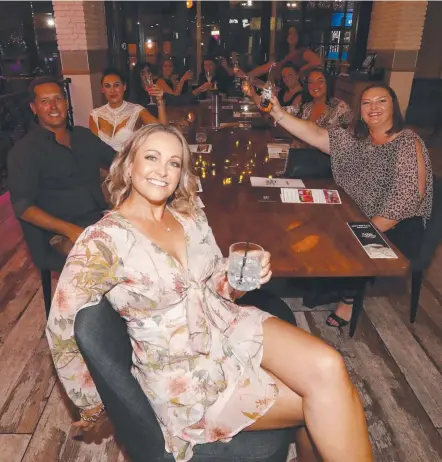  ?? Picture: JASON O’BRIEN ?? Rochelle Prosper enjoys a night out with friends at White Rhino after winning the venue’s table of 10, which included live music from the 42 Band. The popular Surfers Paradise haunt will auction off its table for this Saturday night.