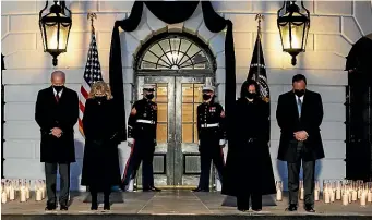  ?? AP ?? President Joe Biden, first lady Jill Biden, Vice President Kamala Harris, and Doug Emhoff share a moment of silence during a ceremony to honour the 500,000 Americans that died from Covid-19, at the White House.