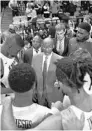  ?? UCF ATHLETICS ?? UCF basketball coach Johnny Dawkins, center, added Ed’Xavior Rhodes, a 6-foot-9 forward out of Skyline High School in Dallas, for the 2021-22 class.