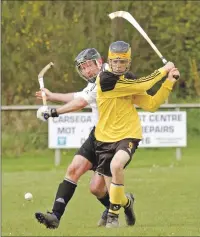  ?? Photo: Donald Cameron. ?? Fort William’s Lewis Clark and Lovat’s James Whyte in action during the North Division One game last weekend.