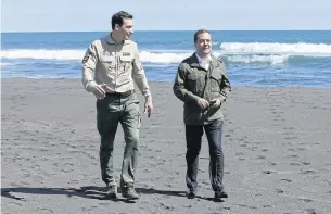  ?? EPA ?? Russian Prime Minister Dmitry Medvedev visits a nature reserve with the Kronotsky State Nature Biosphere Reserve Director Pyotr Shpilenok yesterday. Mr Medvedev has issued a stern warning to the US over proposed furhter sanctions.