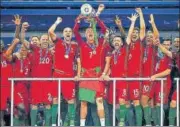  ?? GETTY IMAGES ?? Cristiano Ronaldo lifts the trophy after Portugal beat France in the Euro 2016 final at the Stade de France in Paris.