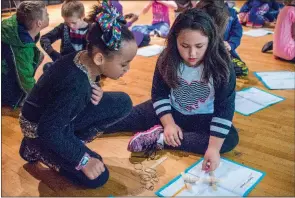  ?? WILLIAM HARVEY/THREE RIVERS EDITION ?? Aleah Rigsby, left, and Serena Murphy design a catapult they will use to launch a candy pumpkin during Thanksgivi­ng STEM Day activities at Sidney Deener Elementary School in Searcy.