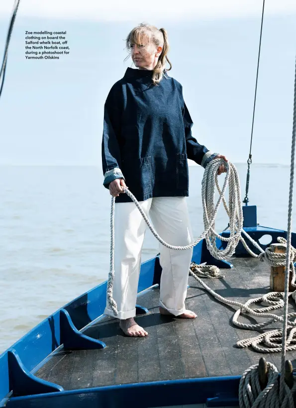  ??  ?? Zoe modelling coastal clothing on board the Salford whelk boat, off the North Norfolk coast, during a photoshoot for Yarmouth Oilskins