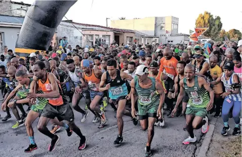  ?? African News Agency (ANA) ?? HUNDREDS of runners from across the province and their supporters gathered in Langa for the Run for Freedom street race to commemorat­e Freedom Day yesterday. The 10km route passed some of the township’s landmarks, including late pop queen Brenda Fassie’s home on Makana Circle, Guga S’thebe cultural hub, and the Langa Old Post Office Museum.
| PHANDO JIKELO