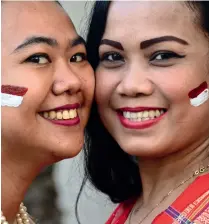  ?? KT File ?? MOVING FORWARD: Indonesian expats with face painted in flag colours during last year’s celebratio­ns. An estimated 100,000 Indonesian­s are currently living and working in the UAE. —