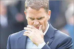  ?? PAUL ELLIS/AFP ?? Frank de Boer walks off the pitch at half-time during Crystal Palace’s English Premier League loss to Burnley at Turf Moor on Sunday.