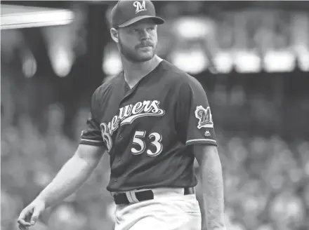  ?? RICK WOOD / JOURNAL SENTINEL ?? Brewers starter Brandon Woodruff retires the side in the third inning Tuesday night.