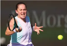  ?? Getty Images ?? Jelena Ostapenko of Latvia plays a shot on her way to a three-set victory against Xiyu Wang of China in Dubai