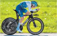  ?? JEANCHRIST­OPHE BOTT THE CANADIAN PRESS FILE PHOTO ?? Canada’s Michael Woods competes in the prologue, a race against the clock, at the 75th Tour de Romandie UCI ProTour cycling race in Lausanne, Switzerlan­d, in April 2022. Woods is headed to his third Giro d’Italia and 11th Grand Tour race.